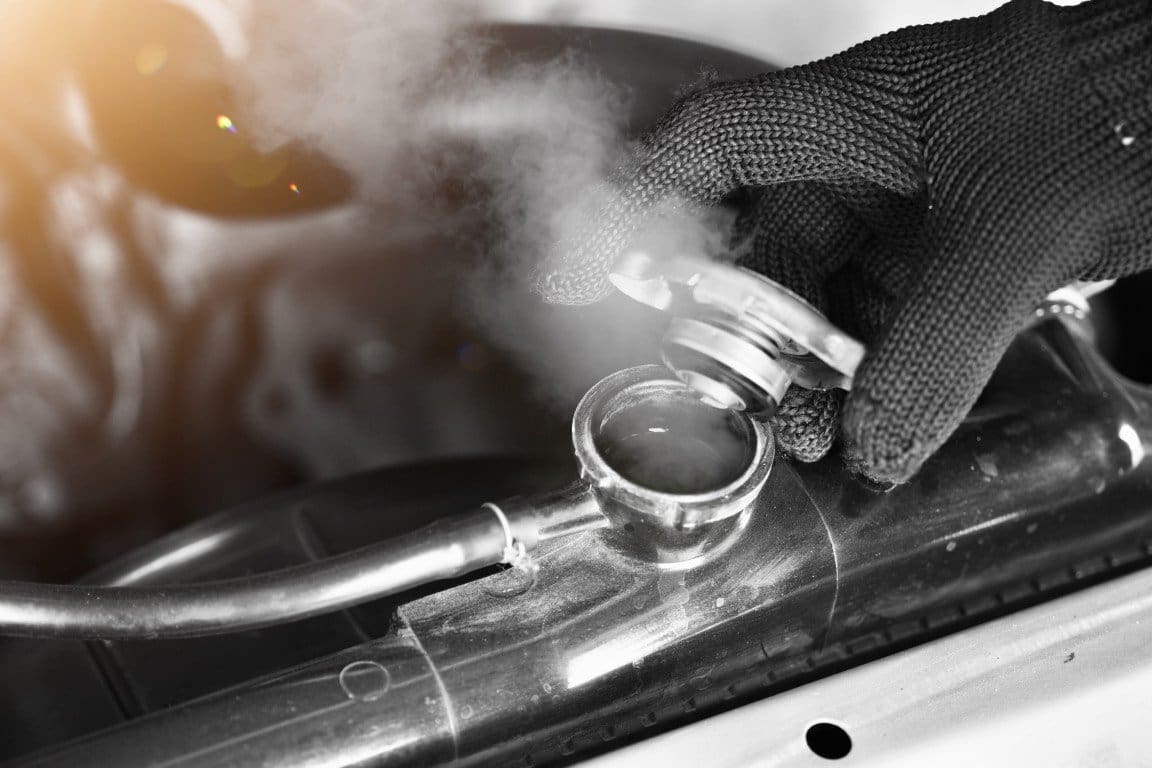 Steam rising from an overheated engine cooling system